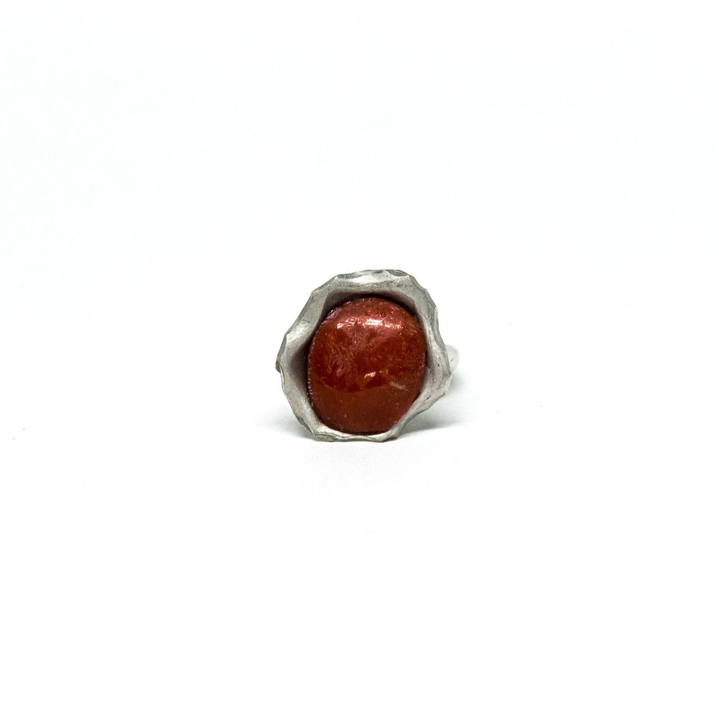 Red coral ring framed by embossed silver