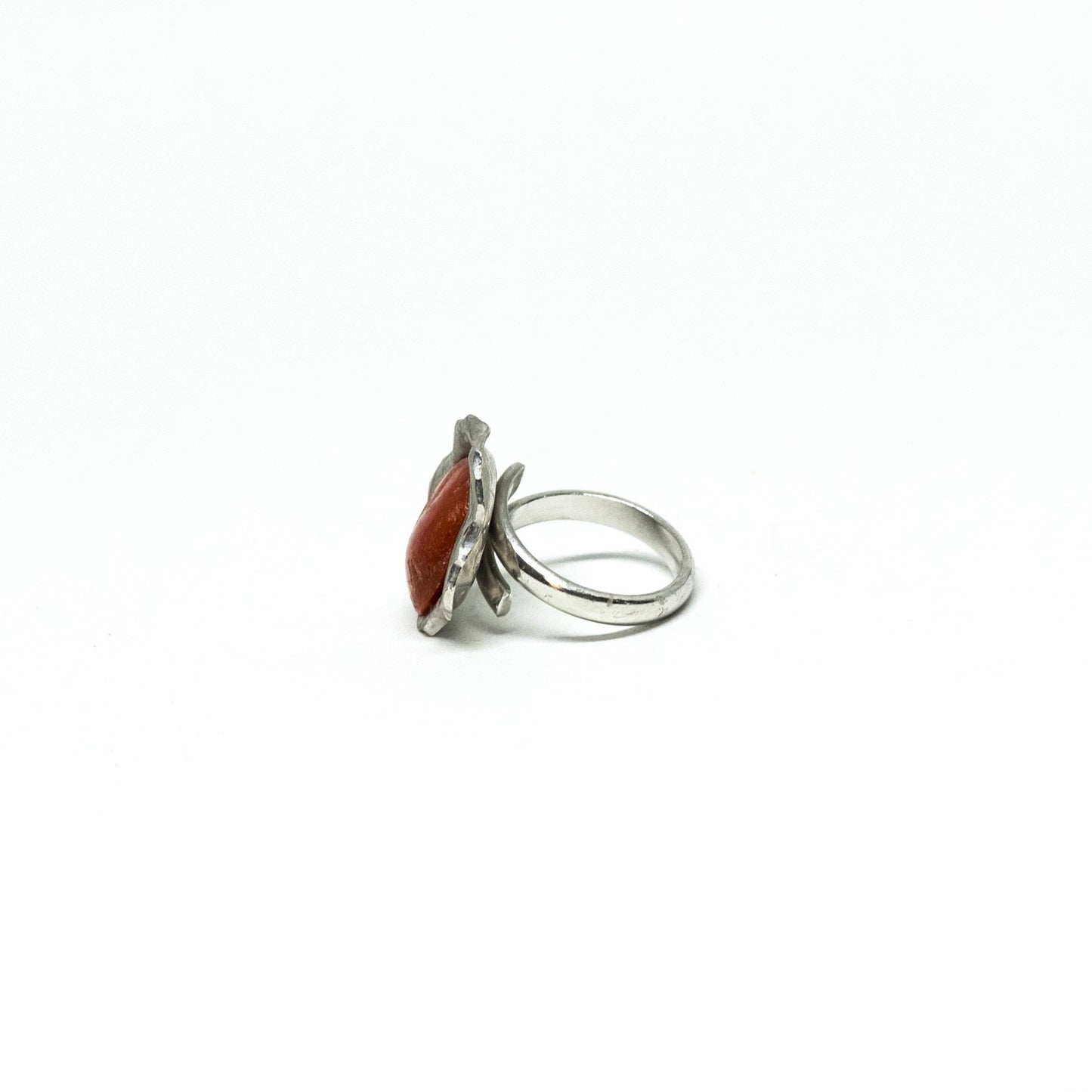 Red coral ring framed by embossed silver
