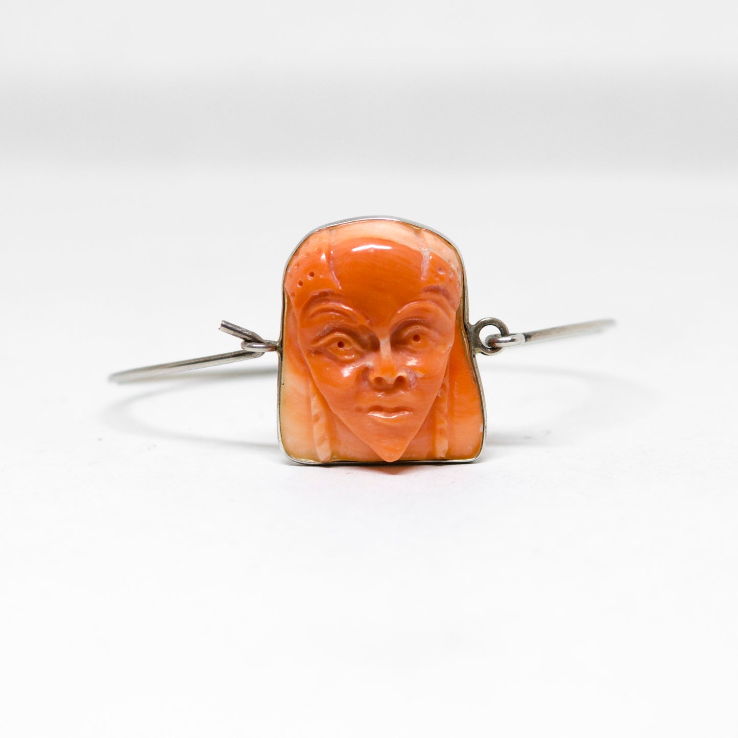 Coral bracelet with carved face