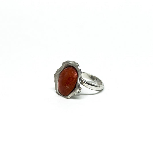 Red coral ring framed by embossed silver